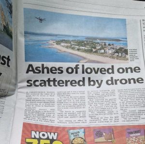Arial ashes in the press scattering ashes by drone